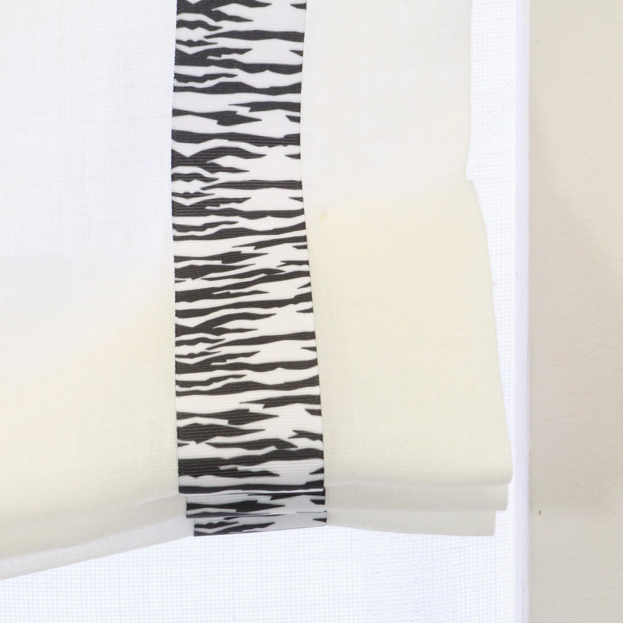 White Linen Relaxed Roman Shade with Animal Print Ribbon