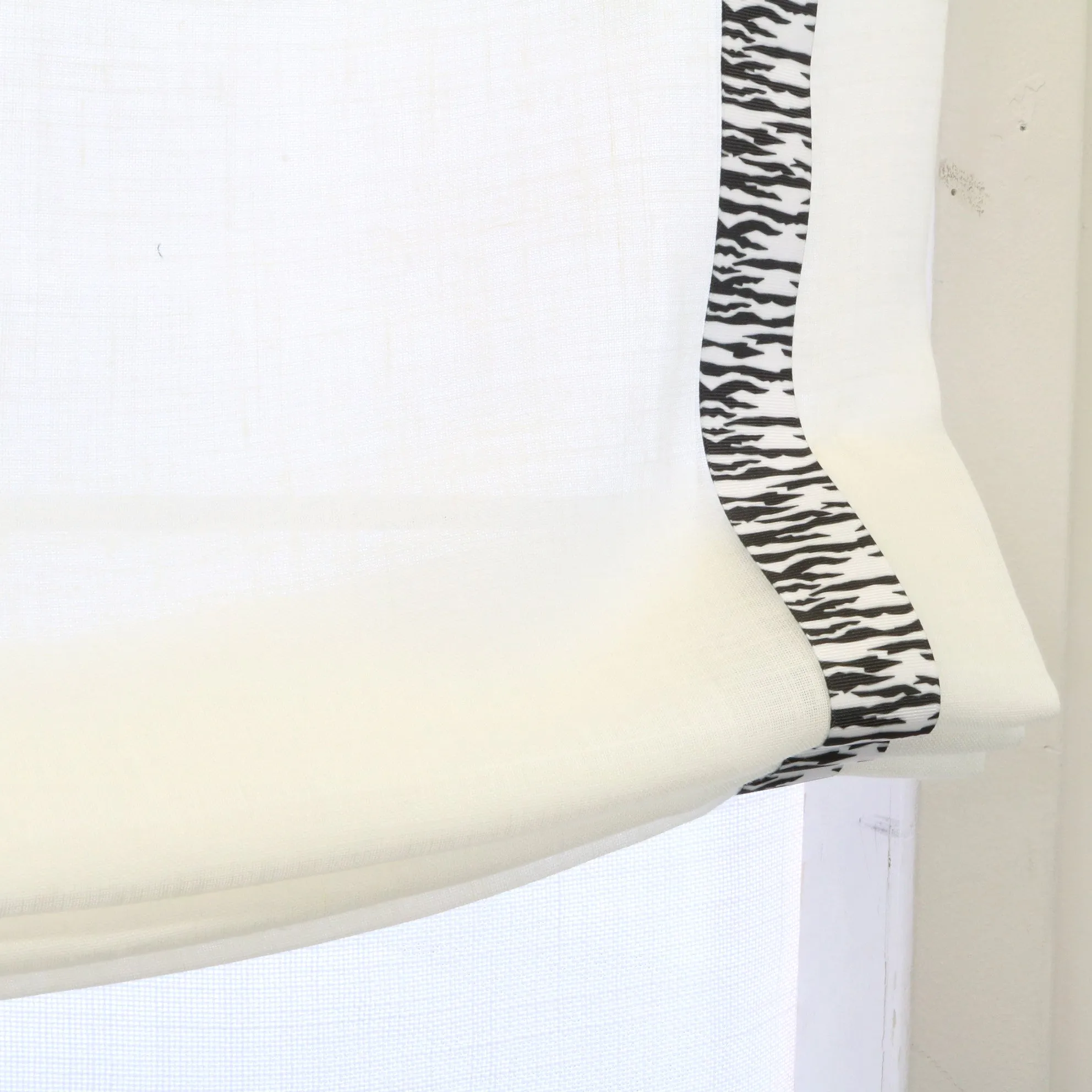 White Linen Relaxed Roman Shade with Animal Print Ribbon